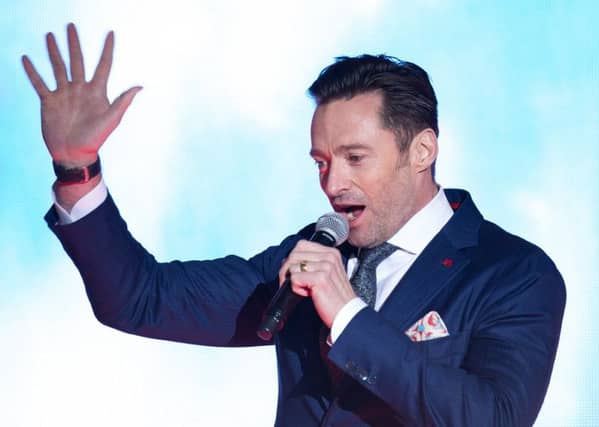 Hugh Jackman performs at a premiere for The Greatest Showman