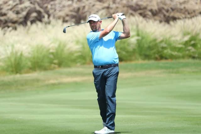 David Drysdale plays his second shot into the fourth green during the first round of the AfrAsia Bank Mauritius Open. Picture: Warren Little/Getty