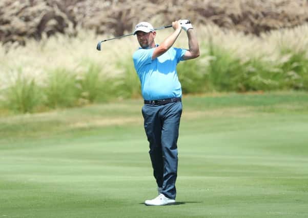 David Drysdale plays his second shot into the fourth green during the first round of the AfrAsia Bank Mauritius Open. Picture: Warren Little/Getty