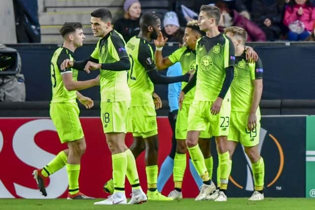 Celtic stars celebrate with Scott Sinclair after his first-half goal. Picture: AP