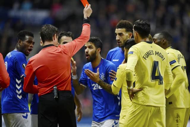 Rangers' Daniel Candeias is shown a red card by referee Matej Jug. Picture: SNS/Rob Casey
