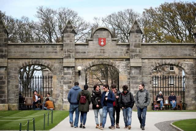 Students outside of the entrance to the Lower and Upper College Halls at the University of St Andrews. Picture: PA