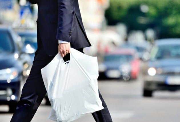The Scottish Government currently requires all retailers to charge 5p per single-use bag (Photo: Shutterstock)
