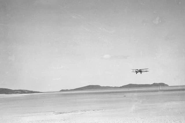 The first plane to land at Barra's Eoligarry Airport, on the Traigh Bhain, the Cockle Strand, August 1936, by Margaret Fay Shaw PIC: from Eilean, ed Fiona J Mackenzie,  courtesy of The Margaret Fay Shaw Photographic Collection, The Canna Archives, National Trust for Scotland and the Morton Charitable Trust team.