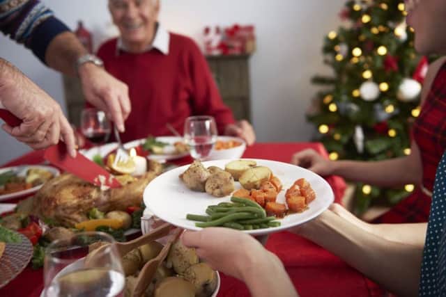 If you're hosting dinner for guests, you could ask them to help out by bringing drinks or a dish or two. Photograph: PA