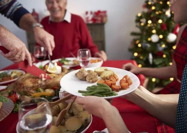 If you're hosting dinner for guests, you could ask them to help out by bringing drinks or a dish or two. Photograph: PA