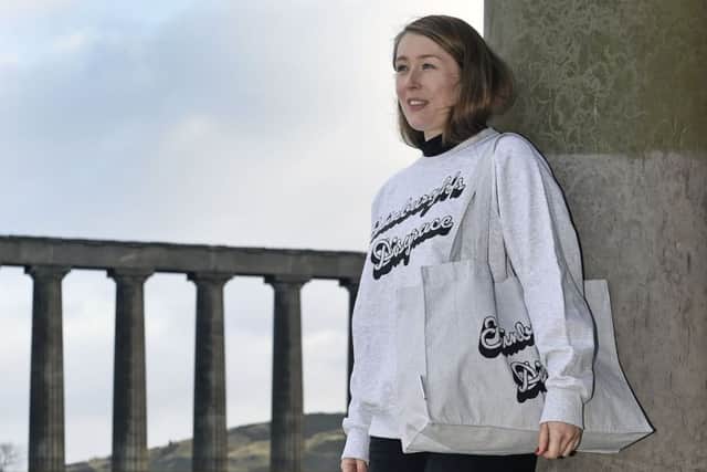 Visitor assistant Eleanor Jones in front of the monument on Calton Hill. Picture: Neil Hanna
