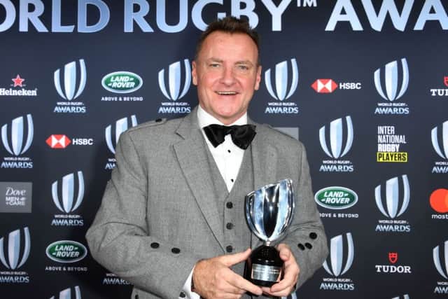 Jamie Armstrong poses with his trophy during the World Rugby Awards. Pic: Yann Coatsaliou/AFP/Getty