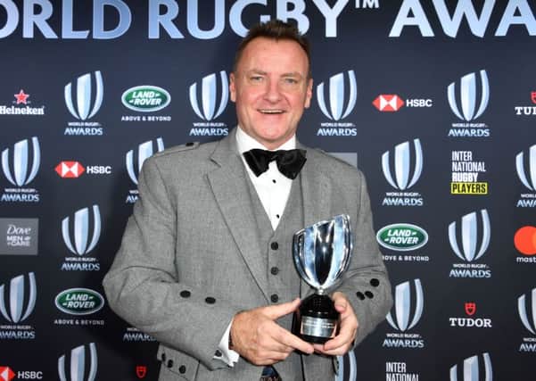 Jamie Armstrong poses with his trophy during the World Rugby Awards. Pic: Yann Coatsaliou/AFP/Getty