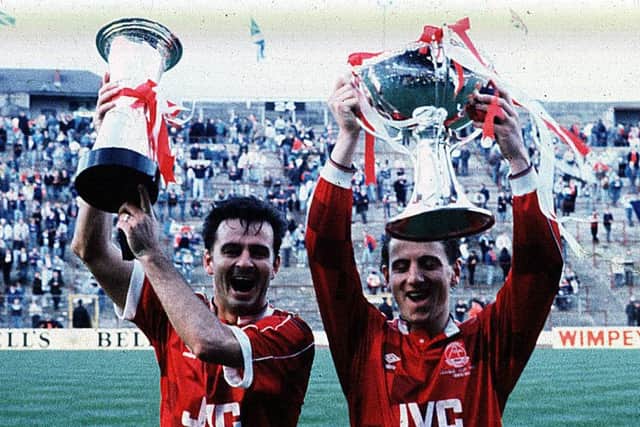 Glory for Charlie Nicholas and Paul Mason as they celebrate Aberdeen's win over Rangers in the 1989-90 Leauge Cup final. Picture: SNS