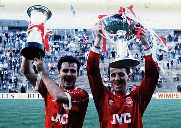Glory for Charlie Nicholas and Paul Mason as they celebrate Aberdeen's win over Rangers in the 1989-90 Leauge Cup final. Picture: SNS