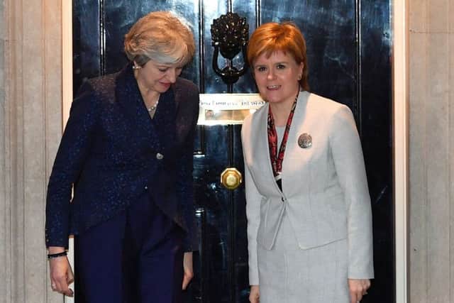 Nicola Sturgeon with Theresa May outside 10 Downing Street last month. The First Minister has criticised Tory MPs for forcing a leadership contest at a time of wider uncertainty caused by Brexit