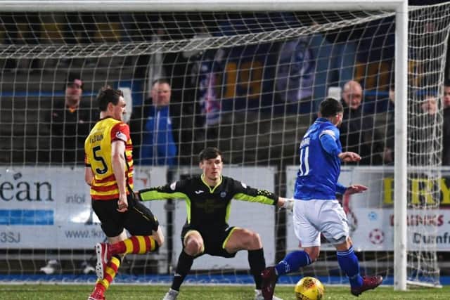Queen of the South's Stephen Dobbie scores the winner. Pic: SNS/Craig Foy