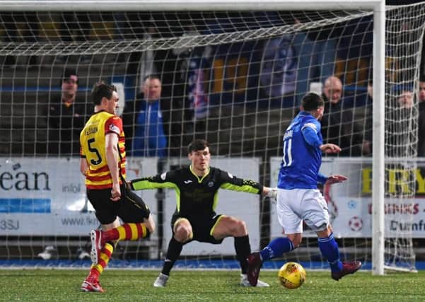 Queen of the South's Stephen Dobbie scores the winner. Pic: SNS/Craig Foy
