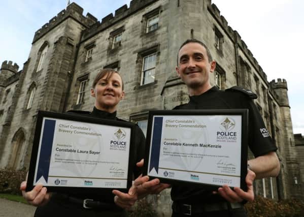 Police Constables Laura Sayer and Kenneth MacKenzie who were seriously injured during the incident in Greenock received an award for their bravery. Picture: Andrew Milligan/PA Wire