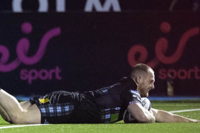 Nick Grigg goes over to score his try. Pic: SNS/SRU/Paul Devlin