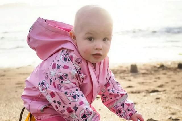 Dave Fletcher took the picture of his daughter Izzy when she was 23 months old - just a few weeks before she was given the shock diagnosis of leukaemia. Picture: SWNS