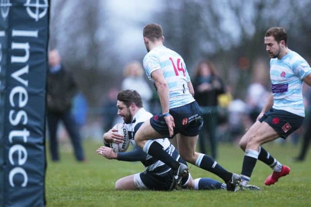Craig Robertson crosses the Accies line to put the icing on the cake of a comfortable win for Heriots. Picture: Graham Stewart/SNS/SRU