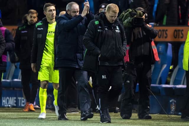 Hibs head coach Neil Lennon trudges back to the dressing room while Kilmarnock boss Steve Clarke applauds the home support. Picture: Alan Harvey/SNS Group