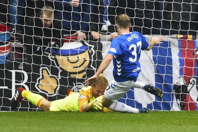 Rangers midfielder Scott Arfield is red carded for a challenge on Zdenek Zlamal. Picture: SNS