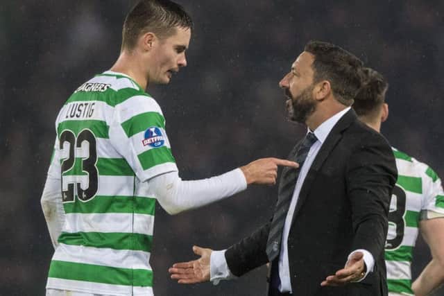 Aberdeen manager Derek McInnes speaks with Celtic's Mikael Lustig after full-time. Picture: SNS