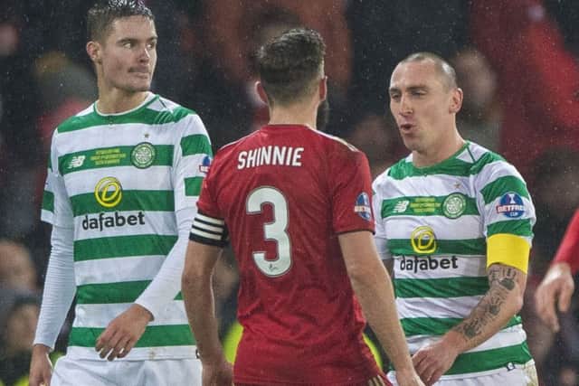 Celtic's Scott Brown, right, exchanges words with Aberdeen's Graeme Shinnie. Picture: SNS