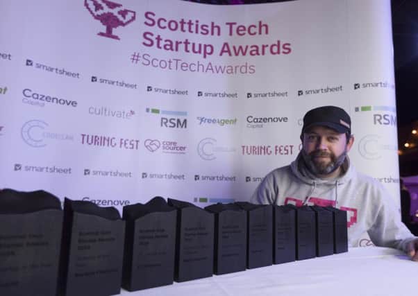 Brian Corcoran, chief executive of the awards, lines up the prizes. Picture: Allan MacDonald