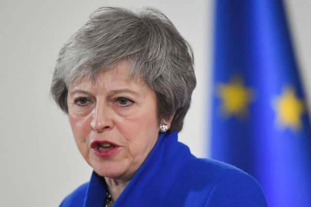 Theresa May has insisted she will "still have a job in two weeks' time". Picture: AFP/Getty