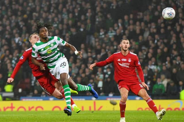 Gary Mackay-Steven clashes heads with Celtic's Dedryck Boyata, with both players suffering injuries. Picture: SNS