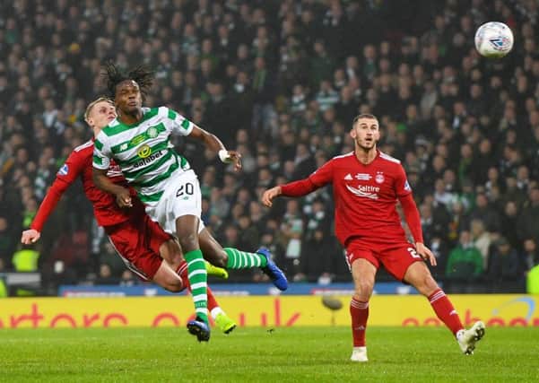 Gary Mackay-Steven clashes heads with Celtic's Dedryck Boyata, with both players suffering injuries. Picture: SNS