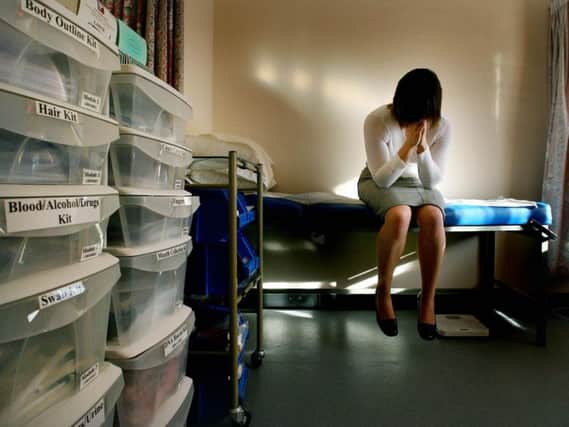 A rape victim waits to be seen by the doctor in the medical room at a specialist clinic. Picture: Gareth Fuller/PA Wire