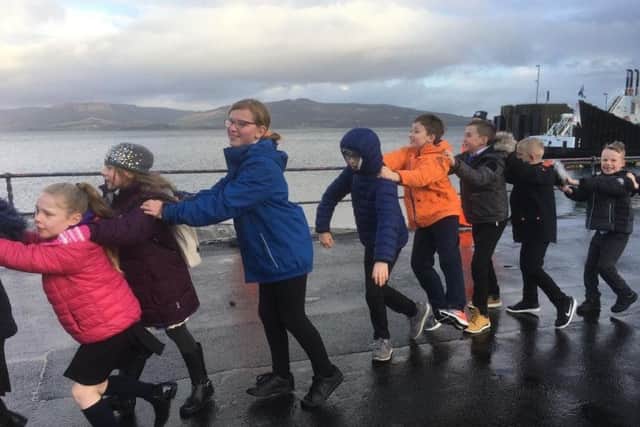 St Andrew's Primary School kids do the St Andrew's Day Conga on Rothesay Esplanade.