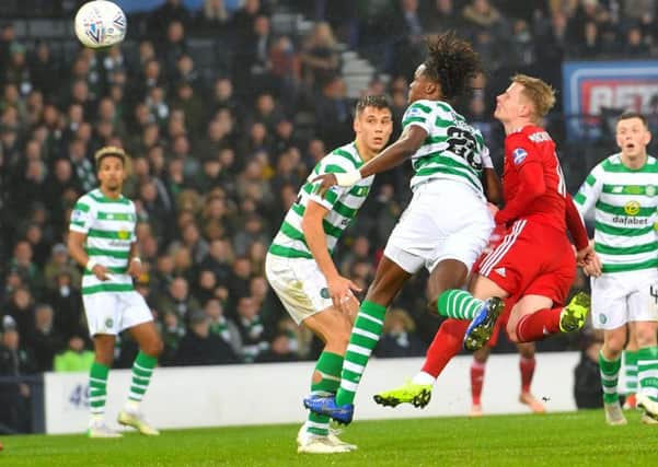 Dedryck Boyata and Aberdeen's Gary Mackay-Steven compete for the ball during the Betfred Cup final and suffer a nasty clash of heads. Picture: SNS