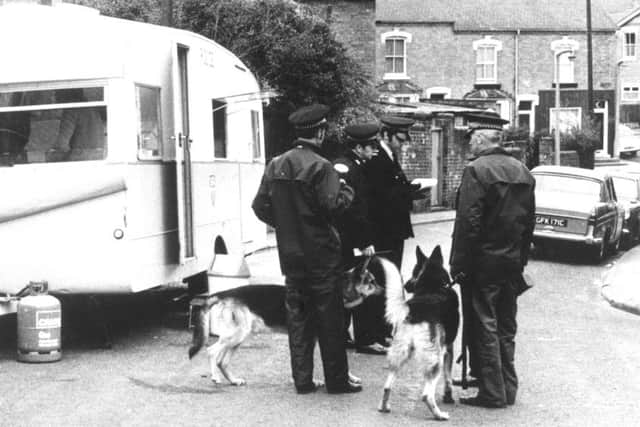 Ppolice setting up an investigation centre in the street, near the house where three young children were found impaled on garden railing in their Worcester home. Picture: PA Wire