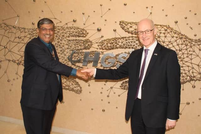 HGSs global chief executive Partha DeSarkar shakes hands with Deputy First Minister John Swinney. Picture: Contributed