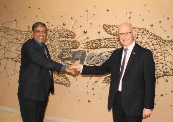 HGSs global chief executive Partha DeSarkar shakes hands with Deputy First Minister John Swinney. Picture: Contributed