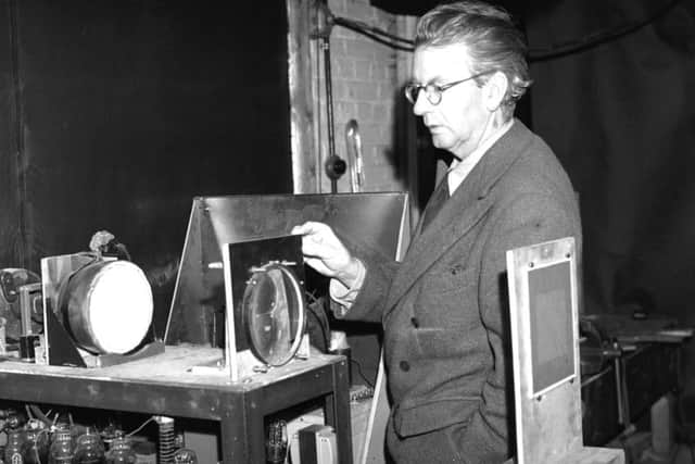 Scottish electrical engineer and television pioneer John Logie Baird giving a demonstration in his laboratory of his latest advance in colour television. Picture: Getty Images