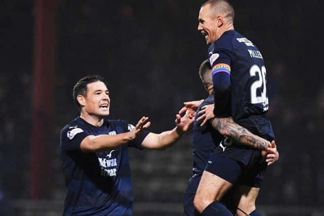 Kenny Miller celebrates his opening goal for Dundee. Picture: SNS