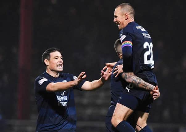 Kenny Miller celebrates his opening goal for Dundee. Picture: SNS