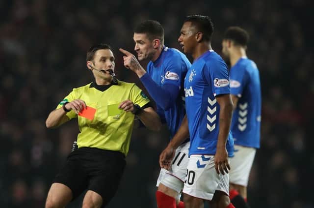Alfredo Morelos sees red as Kyle Lafferty remonstrates with referee Steven McLean. Picture: Getty