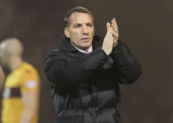 Brendan Rodgers applauds the Celtic supporters. Picture: Craig Foy/SNS