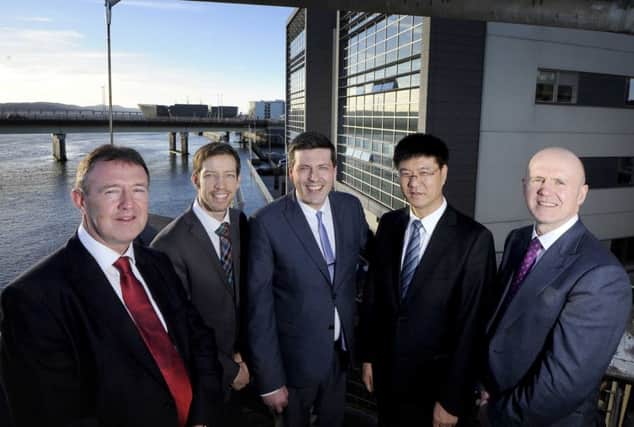 L to R: Norman McLennan, COES; Councillor John Alexander; Jamie Hepburn MSP; Hong Chong, president, COES; and Neil Francis, director, Scottish Development International. Picture: Colin Hattersley