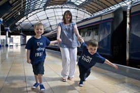 Twins Andrew and James with mum Elinor helping to launch the Kids Go Free offer. Picture: Alan Richardson