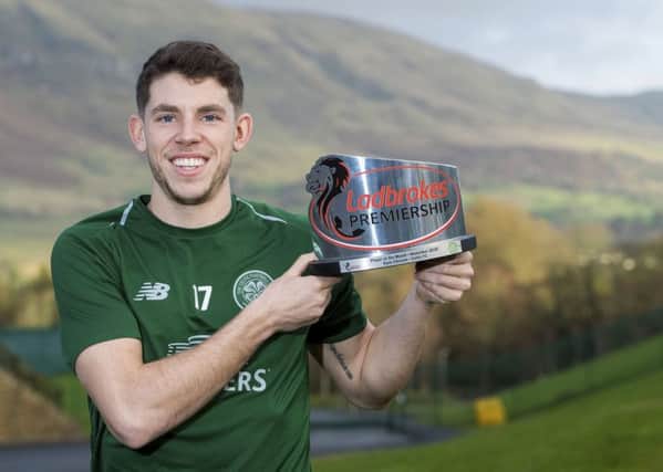 Celtic's Ryan Christie with the Ladbrokes Player of the Month Award for November.