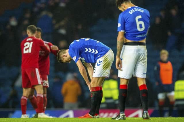 Gareth McAuley, centre, and defensive colleague Connor Goldson show their frustration at the end of Rangers 1-0 defeat by Aberdeen. Picture: Bill Murray/SNS