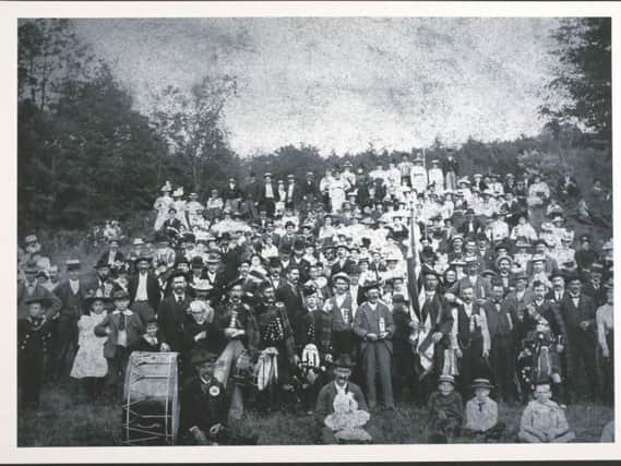 How much of your family can you find? Pictured: Group portrait of the Gordon family  at Cherryvale Grove, Kansas.