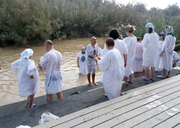 Pilgrims line up for baptism on the banks of the River Jordan at Qasr al-Yahud. Picture: HALO Trust