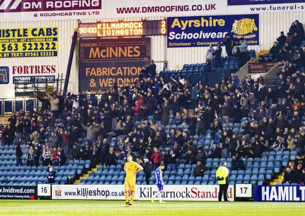 Kilmarnock supporters celebrate after beating Livingston. Pic: SNS