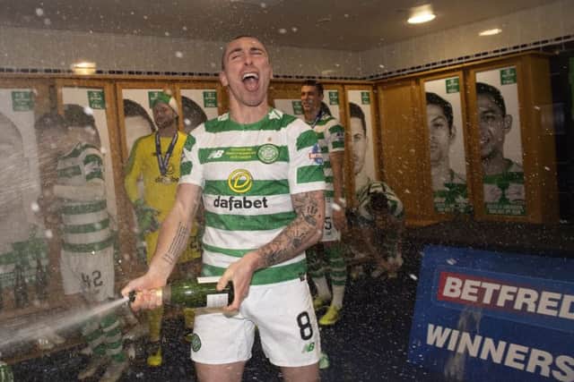 Celtic's Scott Brown, celebrates winning the bookmaker-sponsored Betfred Cup. Pic: SNS