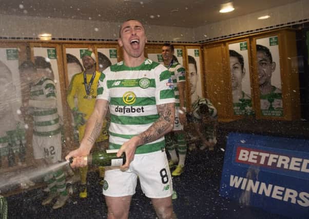 Celtic's Scott Brown, celebrates winning the bookmaker-sponsored Betfred Cup.  Pic: SNS
